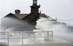 High winds, high tide strike at the main street of Cedar Key, Fla., as Tropical Storm Debby makes it's way across the Gulf of Mexico early Sunday, June 24, 2012. Parts of Florida, including the Panhandle, remain under a tropical storm warning as Debby churns off the Gulf Coast.