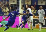 Croatia's Da Silva Eduardo, center, celebrates with Milan Rapaic, left, after scoring the opening goal against England during the Euro 2008 Group E qualifying soccer match in Zagreb, Croatia, Wednesday Oct. 11, 2006. At right is England's Ashley Cole and 2nd right is John Terry.