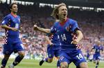 Croatia's Luka Modric, right, reacts after scoring during the group B match between Austria and Croatia in Vienna, Austria, Sunday, June 8, 2008, at the Euro 2008 European Soccer Championships in Austria and Switzerland.