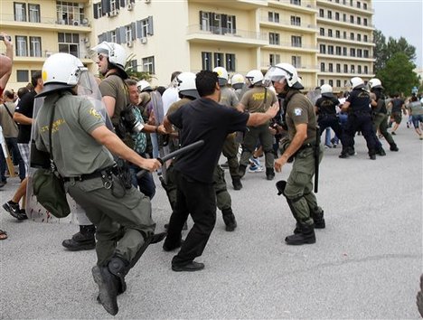 Riot police clash with protesters inside Greece's Defense Ministry in Athens, Thursday, Oct. 4, 2012.