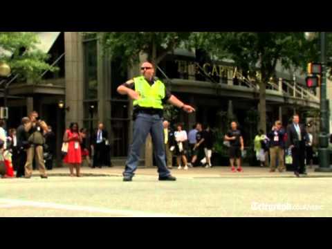 US Election 2012: Dancing police officer entertains drivers at Democratic National Convention