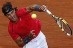 Spain's Rafael Nadal serves the ball to Serbia's Novak Djokovic during their men's final match in the French Open tennis tournament at the Roland Garros stadium in Paris