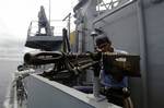 A sailor aboard the Columbian frigate ARC (Armada Republica de Colombia) Antioquia (FL 53) mans a M60 machine gun while standing a bridge security watch during exercise PANAMAX 2006.