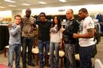 Ultimate Fighting Championship (UFC) fighters and the ring card girl stand together during the UFC Affliction autograph signing at the Marine Corps Air Station Miramar Marine Corps Exchange.