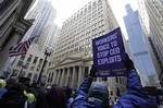 Hundreds of workers protest in the financial district before marching towards AIG offices Thursday, March 19, 2009, in Chicago.