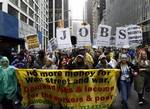 Protesters march down Water Street during a rally against government bailouts for corporations Friday, April 3, 2009 in New York. The protesters, demanding that the government 