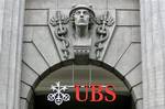 In this Sept. 17, 2008 file photo the lLogo of Swiss bank UBS is seen in Zurich, Switzerland. Swiss bank UBS AG said Tuesday, Feb. 10, 2009 it lost 8.1 billion Swiss francs (U.S. dlrs 7.57 billion) in the fourth quarter and announced it would cut a further 2,000 jobs as it refocuses on its home market after a troubled year abroad. The results exceeded the fears of analysts, who on average had predicted net losses of 6.2 billion francs (U.S. dlrs 5.79 bil