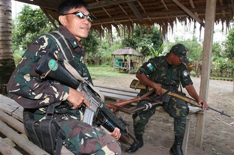 Moro Islamic Liberation Front (MILF) rebels man a rebel-controlled checkpoint at Sultan Kudarat province in southern Philippines in this 2005 file photo.