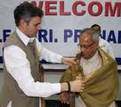 Jammu and kashmir Chief Minister Omar Abdullah shake hands with UPA Presidential candidate Pranab Mukherjee soon after his arrival for campaigning in jammu and kashmir union minister for new and renewable energy Farooq Abdullah is also present at Skicc on the banks of Dal Lake in Srinagar on 15, July 2012. Mukherjee is on a visit to jammu kashmir in order to garner support for the Presidential election shedule to be held on July 19.