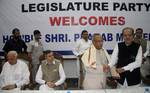 Jammu and kashmir Chief Minister Omar Abdullah JKPCC Chief Safi-u-din Sooz felciated UPA Presidential candidate Pranab Mukherjee soon after his arrival for campaigning in jammu and kashmir union minister for new and renewable energy Farooq Abdullah is also present at Skicc on the banks of Dal Lake in Srinagar on 15, July 2012.. Mukherjee is on a visit to jammu kashmir in order to garner support for the Presidential election shedule to be held on July 19.