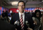 Republican presidential candidate, former Pennsylvania Sen. Rick Santorum, sepaks to reporters in the spin room after the Republican presidential candidate debate at the University of South Florida in Tampa, Fla., Monday, Jan. 23, 2012. (AP Photo/Charles Dharapak)