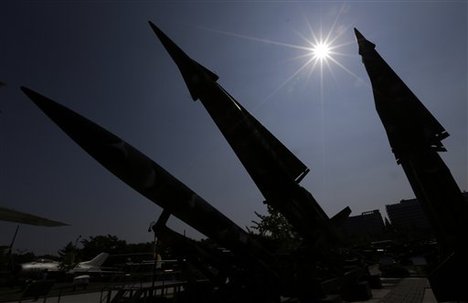 South Korean mock missiles are silhouetted at the Korea War Memorial Museum in Seoul, South Korea, Sunday, Oct. 7, 2012.