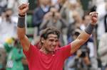 Rafael Nadal of Spain cries after winning the mens final match against Novak Djokovic of Serbia at the French Open tennis tournament in Roland Garros stadium in Paris