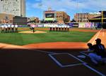 TOLEDO, Ohio Seaman Rob Gilmore, Leading Seaman aboard the U.S. Coast Guard Cutter Neah Bay, homeported in Cleveland, and a native of Fredericksburg, Va., throws out a ceremonial first pitch before a game between the Toledo Mudhens and the Scranton/Wilkes-Barre Yankees at Fifth Third Field, here, July 14, 2011. The cutters crew was honored during a pregame ceremony for the work they do as part of Coast Guard operations throughout the Great Lakes, year-round. (U.S. Coast Guard photo by Petty Offi