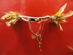 Exhibit in the Oceanic collection of the Staatlichen Museums für Völkerkunde München, Maximilianstraße 42, Munich, Germany. Head band made of pandanus leaf, nassa shells, feathers, cuscus teeth, cloth, pearl shell, Tolai, 1890.