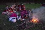 A Kashmiri nomad, family prepare food on the banks of Dal Lake in Srinagar, the summer capital of Indian Kashmir, 13 September 2012.