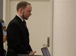 Confessed mass killer Anders Behring Breivik leaves the courtroom after the trial, Friday, Aug. 24, 2012, in Oslo, Norway. A Norwegian court sentenced Anders Behring Breivik to prison on Friday, denying prosecutors the insanity ruling they hoped would show that his massacre of 77 people was the work of a madman, not part of an anti-Muslim crusade. Reading the ruling, Judge Wenche Elisabeth Arntzen handed down a sentence of 