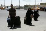 Palestinians return from Egypt cross into the southern Gaza Strip at the Rafah border crossing on August 10, 2012. Egyptian military forces have captured six ''terrorists'' in the Sinai region after an attack on a police station earlier this week that killed 16 border guards, state television quoted a military source on Friday as saying. Hamas has ruled out suggestions that Palestinian gunmen took part in the Sinai massacre and have criticised Cairo for imposing ''collective punishment'' on the