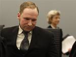 Confessed mass killer Anders Behring Breivik leaves the courtroom after the trial while judge Wenche Elisabeth Arntzen passes in background , Friday, Aug. 24, 2012, in Oslo, Norway. A Norwegian court sentenced Anders Behring Breivik to prison on Friday, denying prosecutors the insanity ruling they hoped would show that his massacre of 77 people was the work of a madman, not part of an anti-Muslim crusade. Reading the ruling, Judge Wenche Elisabeth Arntzen handed down a sentence of 