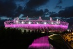 The Olympic Stadium during the 2012 Summer Olympics. Plastic, or perhaps an environmentally sustainable fabric, such as hemp, was initially expected to be wrapped around the stadium exterior and imprinted with a mural-type design.