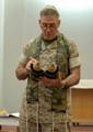 Rear Adm. Harold L. Robinson, Deputy Chief of Chaplains for Reserve Matters and Director of Religious Programs, Marine Force Reserve, reads from the Torah during a morning Rosh Hashana service at the Naval Support Activity Bahrain chapel.