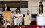 Senator Carl Levin, Michigan (D), speaks before a crowd of several hundred people gathered in the hangar bay during the Torah dedication ceremony on board the Nimitz-class aircraft carrier USS Harry S. Truman (CVN 75).