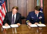 JUNEAU, Alaska (May 29)--Capt. Rick Houck, Coast Guard 17th District Chief of Staff and Ed Page, Executive Director of the Marine Exchange of Alaska signed a Memorandum of Understanding today for evaluating vessel-positioning information provided by Marine Exchange automated vessel tracking system. USCG photo by PO Darrell Wilson (82579) ( MOU SIGNING (FOR RELEASE) )