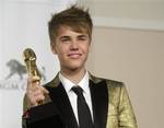 Singer Justin Bieber poses in the press room at the 2011 Billboard Music Awards in Las Vegas on Sunday, May 22, 2011.