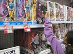 A child picks a Justin Bieber fashion doll on display for sale at Toys R US store in Mayfair Mall in Victoria, British Columbia, Canada on June 9, 2011.