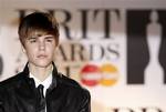 Justin Bieber arrives for the Brit Awards 2011 at The O2 Arena in London, Tuesday, Feb. 15, 2011.