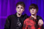 Canadian musician Justin Bieber, left, puts his arm around the new waxwork figure of himself at Madame Tussaud's in London, Tuesday, March. 15, 2011.