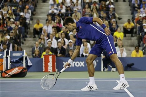 Serbia's Novak Djokovic argues a call while playing Britain's Andy Murray during the championship match at the 2012 US Open tennis tournament, Monday, Sept. 10, 2012, in New York.