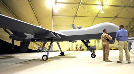 File - U.S. Air Force Lt. Col. Morgan Curry briefs Deputy Secretary of Defense William J. Lynn III on the capabilities of a Predator unmanned aerial vehicle at Kandahar Air Field, Afghanistan, Sept. 10, 2009.