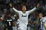 Real Madrid's Cristiano Ronaldo from Portugal, centre, celebrates his goal during a Spanish La Liga soccer match against Deportivo la Coruna at the Santiago Bernabeu stadium in Madrid, Spain, Sunday, Sept. 30, 2012.