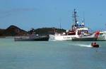 Emergency personnel tend to the injured passengers off a cruise ship, role-played by local citizens, at the Heritage Quay Harbor in St. John's, Antigua, during the disaster scenario for Tradewinds 2002. Tradewinds 02, held in Antigua-Barbuda on 6-26 April 2002, is a multi-phased, joint field training exercise that provides participating nations an opportunity to assemble a multinational force to promote interoperability, improve collective readiness, enhance regional engagement, and foster profe