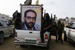 A Palestinian Islamic Jihad militants take part in a rally with guns, vehicles and marching marking the 17th anniversary of the killing of Fathi Shiqaqi, the militant movement's founder, in Rafah in the southern Gaza Strip on October 2, 2012. The militants have accused Israel's spy agency Mossad of assassinating Shiqaqi in Malta in 1995.Photo by Ahmad Deeb / WN