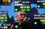 A businessman walks past an electronic stock board in Tokyo, Japan, Wednesday, Oct. 22, 2008. Japanese stocks veered sharply downhill Wednesday, as spreading pessimism over corporate earnings and a strengthening yen sent the benchmark index tumbling almost 7 percent. The Nikkei 225 stock average fell 631.56 points, or 6.79 percent, to 8,674.69. The broader Topix index lost 7.05 percent to 88