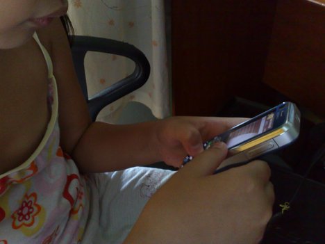 A child using cellphone.