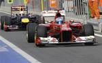 Ferrari driver Fernando Alonso of Spain leads Red Bull driver Sebastian Vettel of Germany as they drive down pit lane during the third practice session of the Korean Formula One Grand Prix at the Korean International Circuit in Yeongam, South Korea, Saturday, Oct. 13, 2012.