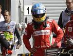 Ferrari driver Fernando Alonso of Spain looks on after the qualifying session ahead the Belgium Formula One Grand Prix in Spa-Francorchamps circuit , Belgium