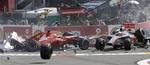 Ferrari driver Fernando Alonso of Spain, left, crashes with McLaren Mercedes driver Lewis Hamilton of Britain during the first lap of the Belgium Formula One Grand Prix in Spa-Francorchamps circuit , Belgium