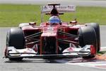 Ferrari driver Fernando Alonso, of Spain steers his car during the second free practice of the Italian Formula One Grand Prix, at the Monza racetrack, Italy