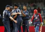 Deccan Chargers bowler Harmeet Singh, third left, celebrates with team-mate after taking the wicket of Delhi Daredevils Virender Sehwag, right, during an Indian Premier League (IPL) cricket match between Delhi Daredevils and Deccan Chargers in New Delhi, India, Tuesday, April 19, 2011.