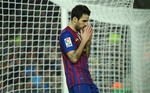 FC Barcelona's Cesc Fabregas reacts during the Spanish La Liga soccer match against Sporting Gigon at the Camp Nou stadium in Barcelona, Spain, Saturday, March 3, 2012.