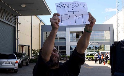 Aiming even higher ... a Hanson supporter waits for his hero.