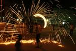 A Palestinian boys play with fire crackers as they celebrate the beginning of Ramadan, a holy month of dawn-to-dusk fasting, festivities and abstinence in Rafah, southern Gaza Strip on July 18, 2012. The Muslim holy month of Ramadan begins Friday 20 July or Saturday 21 July, is traditionally determined by the sighting of a new crescent moon, often dividing rival Islamic countries and sects over the exact date.Photo by Ahmed Deeb / WN