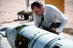 A Soviet inspector examines a BGM-109G Tomahawk ground launched cruise missile (GLCM) prior to its destruction.