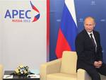 Russian President Vladimir Putin waits to greet Chinese President Hu Jintao before their meeting during the Asia-Pacific Economic Cooperation (APEC) summit in Vladivostok, Russia, Friday, Sept. 7, 2012.