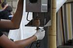 Process of production of homemade chips, Czech Republic. Firstly potato is cutted to the long and narrow slices.