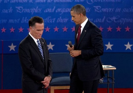 President Barack Obama and Republican presidential candidate, former Massachusetts Gov. Mitt Romney, pause as they participate in the second presidential debate, Tuesday, Oct. 16, 2012, at Hofstra University in Hempstead, N.Y.